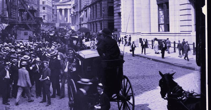 A packed street of traders in bowler hats, New York, 1902