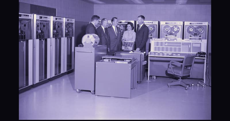 Engineers wiring cabinets of an early IBM mainframe, 1961